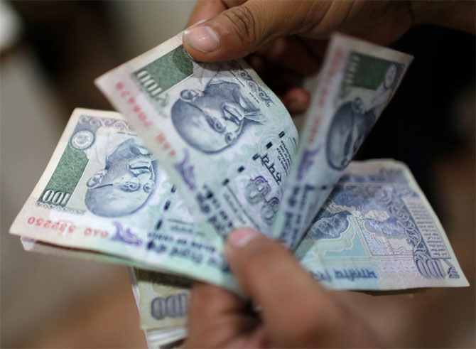 Rupee climbs 4 paise against dollar