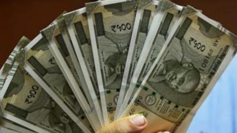 Rupee recovers 7 paise against US dollar