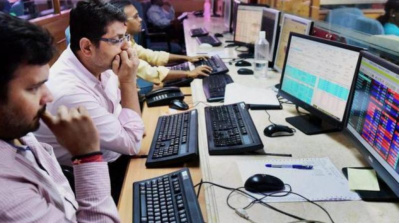 Sensex retreats from record level, plunges by 207 points