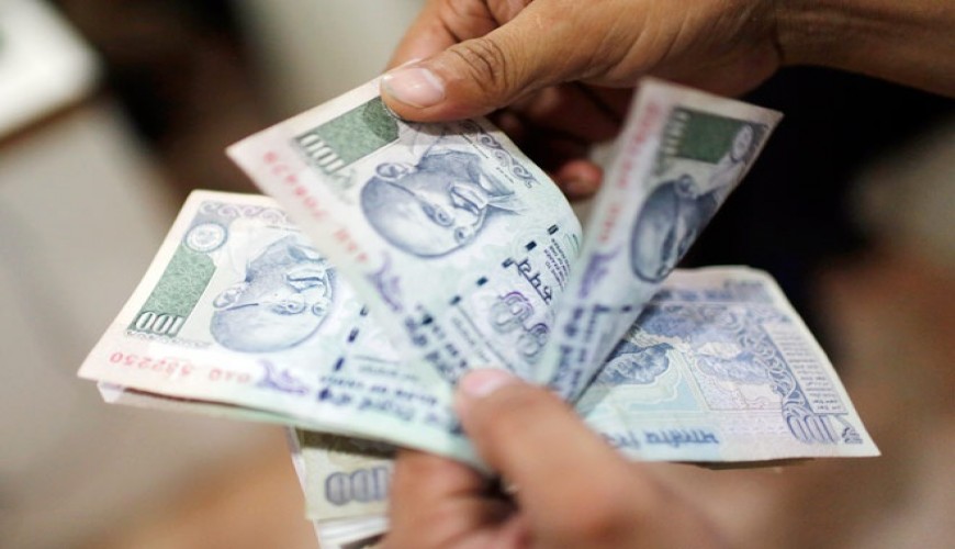 Rupee gains 2 paise against dollar, Fed decision ahead