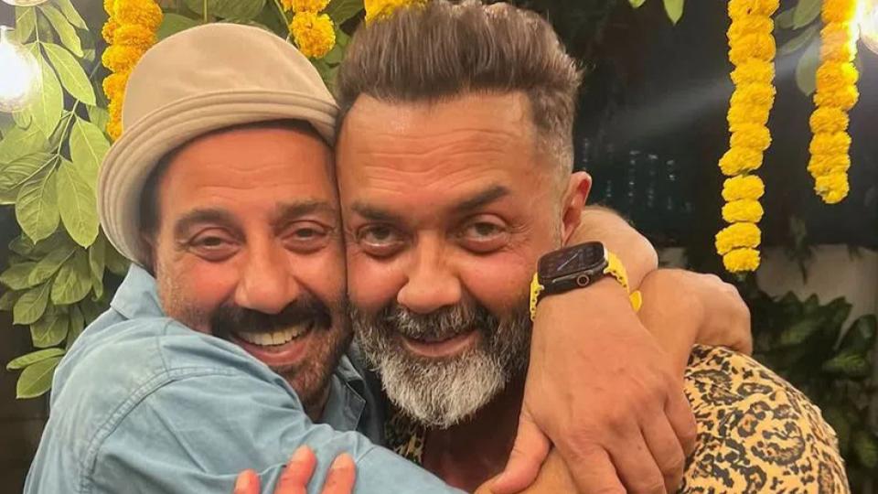 sunnydeollovinglywrapsarmsaround‘littlebrother’bobbydeol