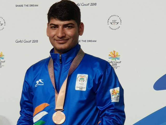 Image result for Om Mitrawal won a bronze medal in the 50 meter air pistol even