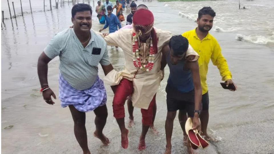 Groom carried on shoulders due to flood water in Karimnagar