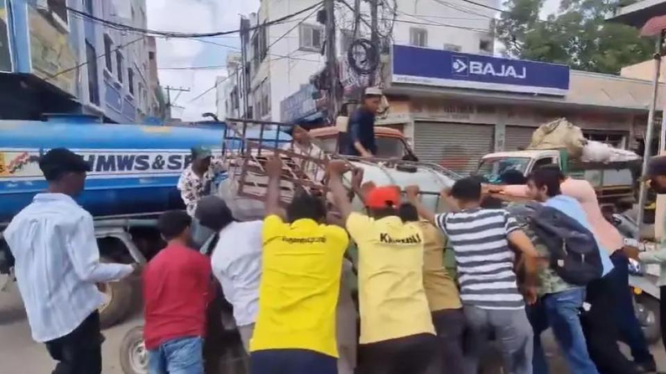 Water Tanker Auto Gets Stuck in Manhole Near Bandlaguda