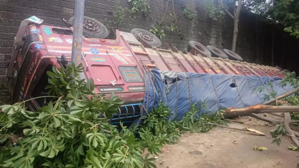 Lorry carrying cement bags fells from ORR in Shamshabad