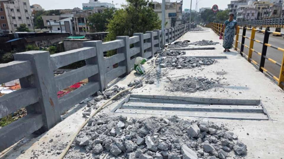Freshly laid footpaths on Moosarambagh bridge dug up for cable work