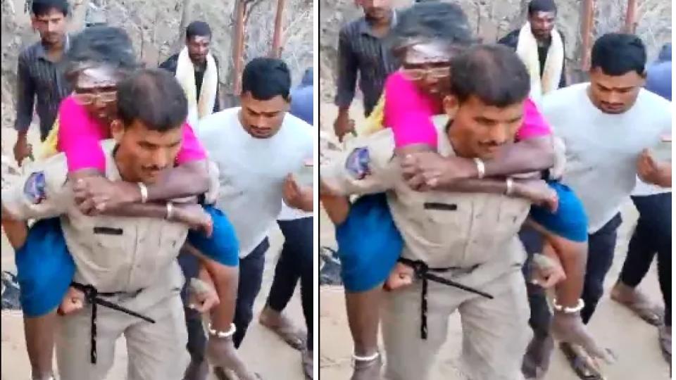 Cop wins hearts carrying woman devotee on his back on rocky terrain