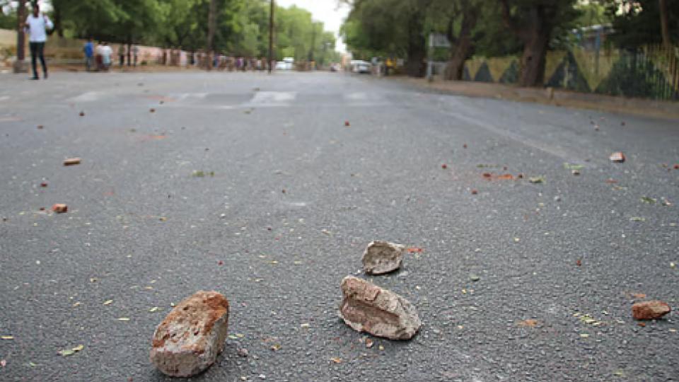 Four men allegedly pelted stones amd damaged a private bus in Chaitanyapuri