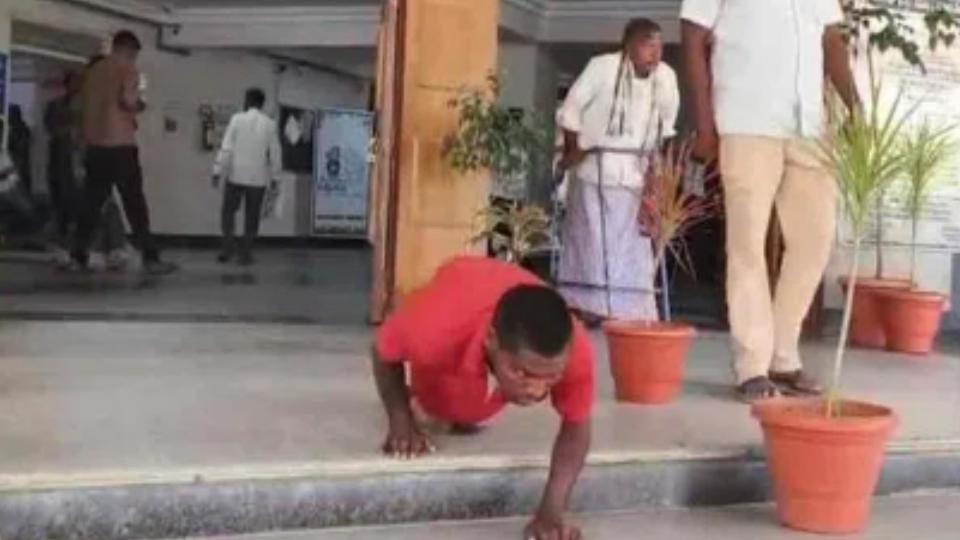 Handicapped persons crawl into Sangareddy collectorate 
