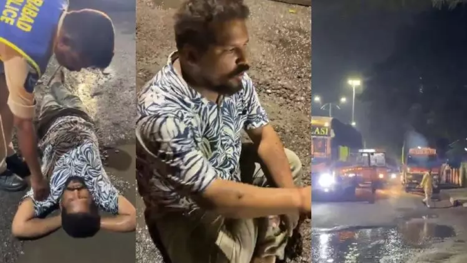 Man Sits Near Pothole, Demands Road Repairs in Imlibun