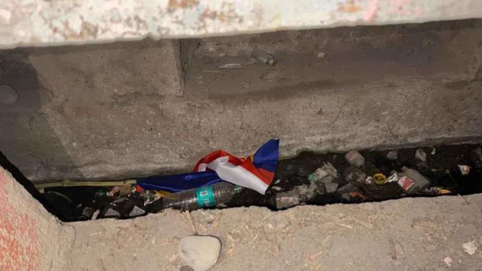 ambedkarflagsdumpedinroadsidedraininadilabad