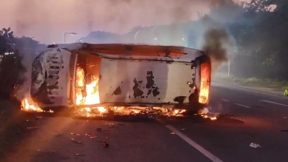 Car caught fire after hitting a road divider in Nalgonda