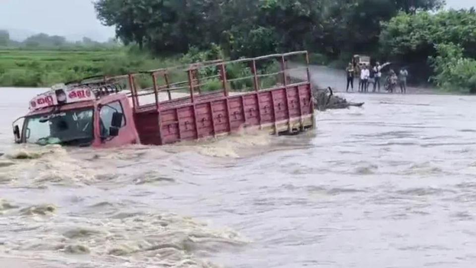 Goods truck washed away along with driver in Khammam