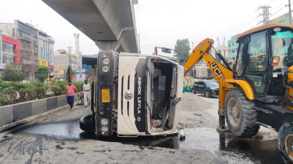 Loaded truck turns turtle at JNTU Metro Station