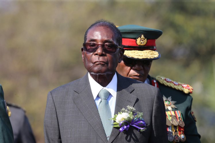 zimbabwepresidentmugaberefusestoresign