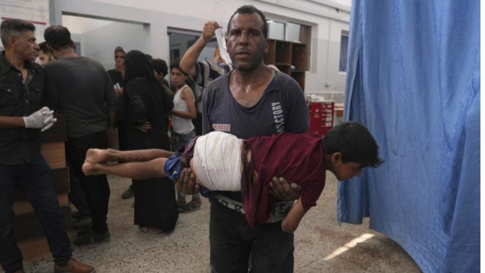 74 killed in Gaza as Israel forces strike a cafe and fire on people seeking food