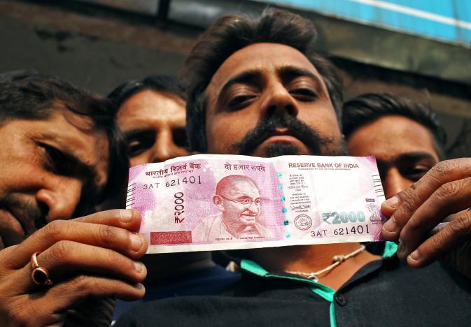 angerrisinginindiaasbanksslowtodispensecashtomillions