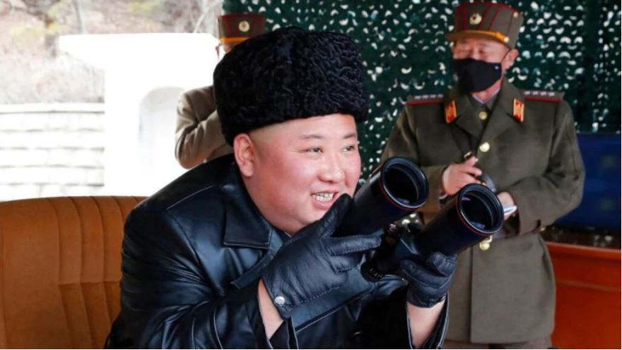 kimjongunwatchesnorthkoreamilitarydrillwithmaskedofficersbyhisside