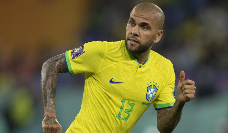 Former Barcelona and Brazilian footballer Dani Alves convicted of raping a woman and sentenced to four and a half years in prison