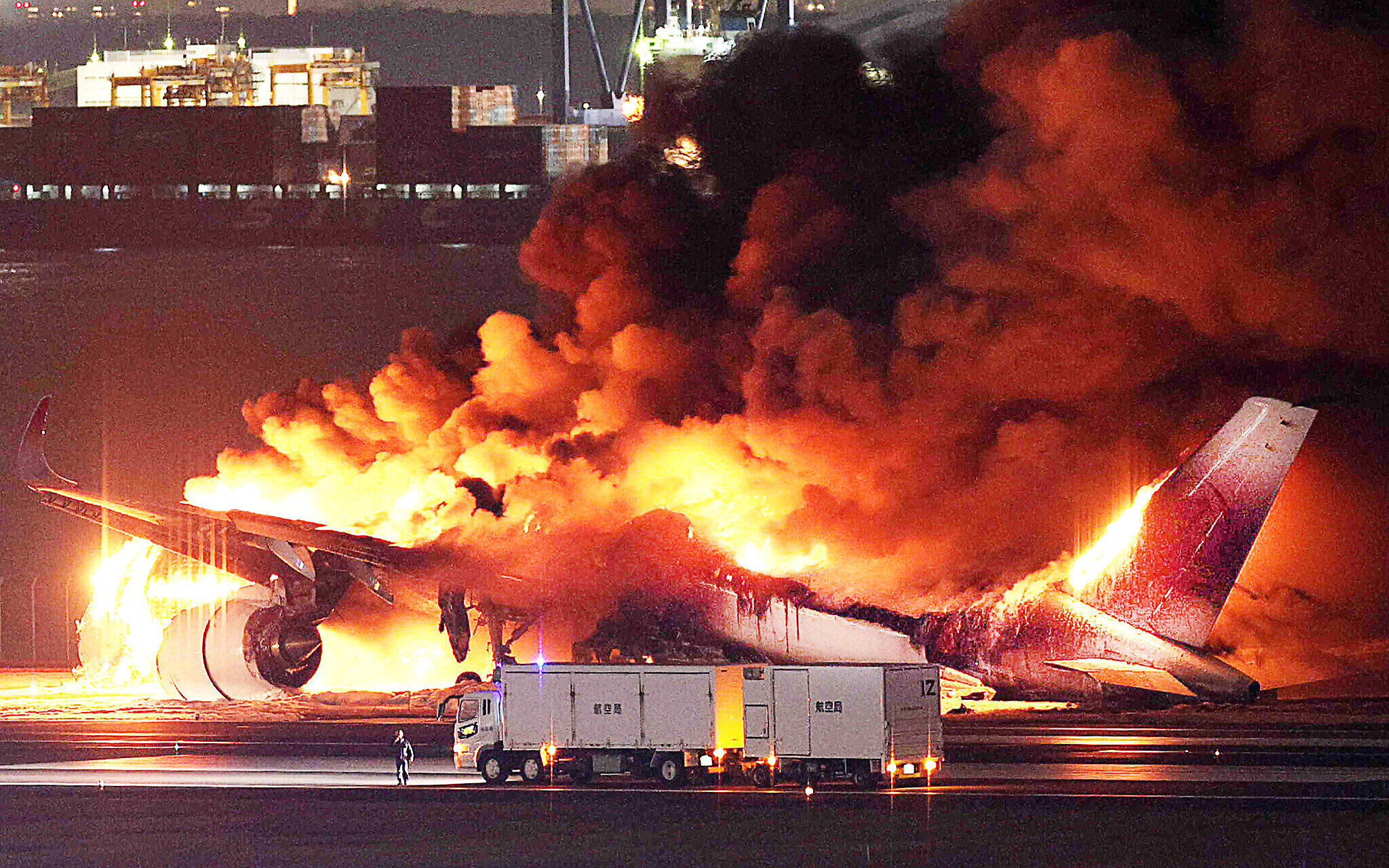 japanairlinesaircraftcatchesfireonrunwayattokyoshanedaairport;5dead