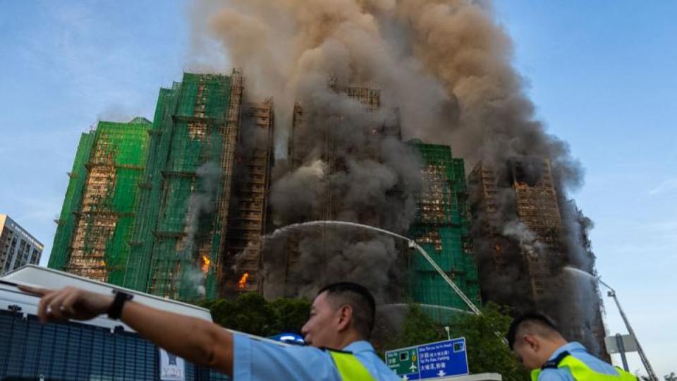 Fire engulfs high-rise building in Hong Kong, 13 dead