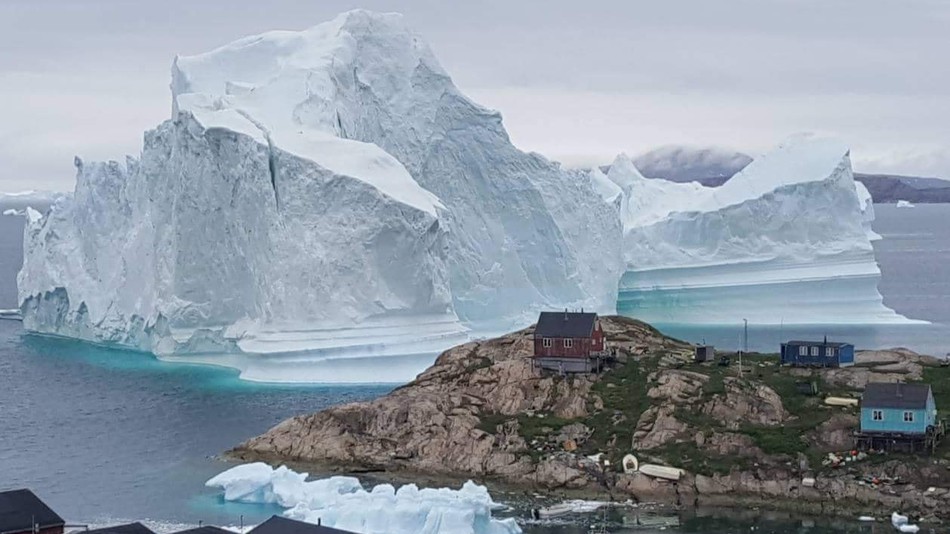 icebergdangerouslyclosetogreenlandvillageseeninsatellitephoto