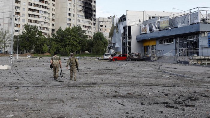 Russians withdraw from around Kharkiv, batter east