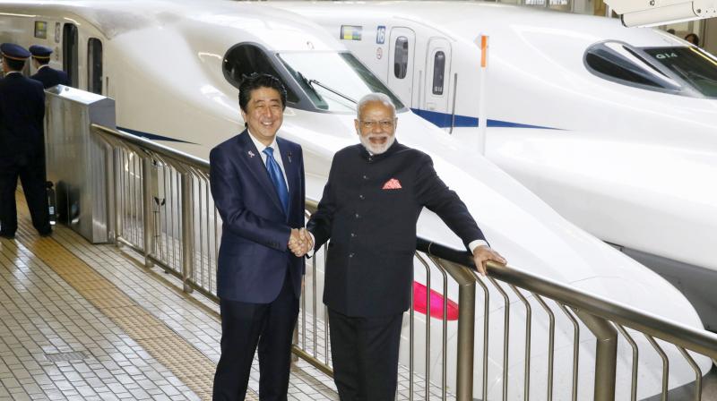 pmmodiaberideonjapansbullettrain