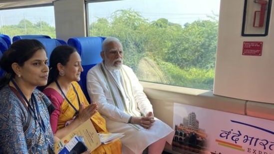 moditakesrideonboardvandebharatexpress