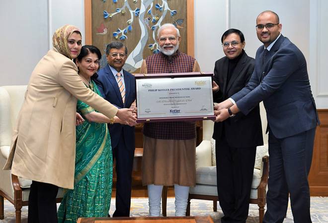 pmnarendramodireceivesfirsteverphilipkotlerpresidentialawardforoutstandingleadershipfornation