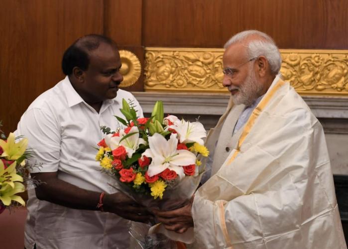 kumaraswamymeetspmmodiseeksrs1199croreforfloodhitareasofkarnataka