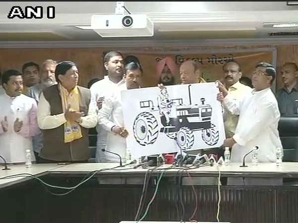 vaghelaunveilspartysymbolforjanvikalpmorcha