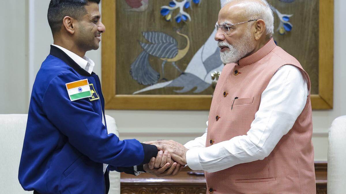 PM Modi meets Shubhanshu Shukla, astronaut gifts tricolour he carried into space