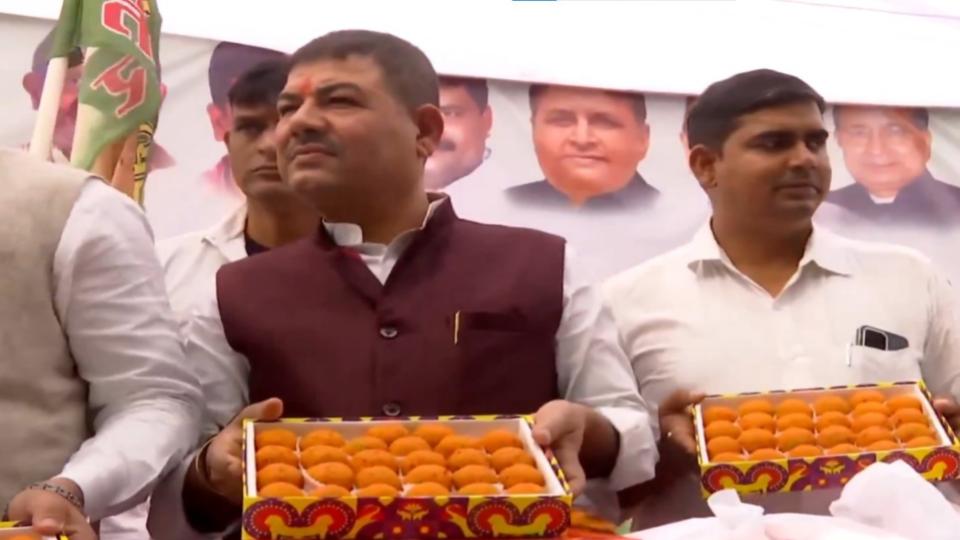 Janata Dal (United) supporters celebrate outside party office in Patna