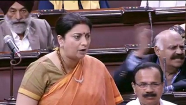 briefuproarinloksabhaoverprivilegemotionagainstsmritiirani