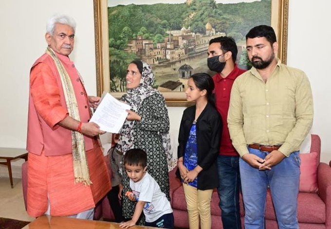 jklgmanojsinhahandsoverappointmentlettertowifeofmartyrciviliansanjaysharmaatrajbhawanjammu